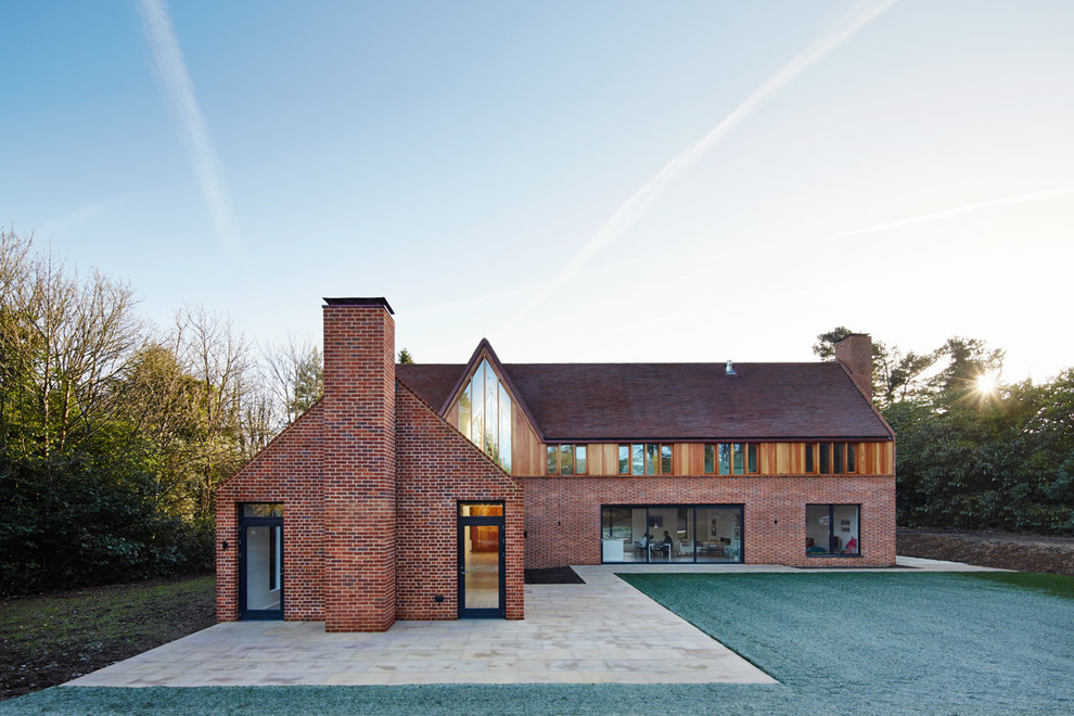 This is an example of a contemporary two-storey exterior in Buckinghamshire with mixed siding.