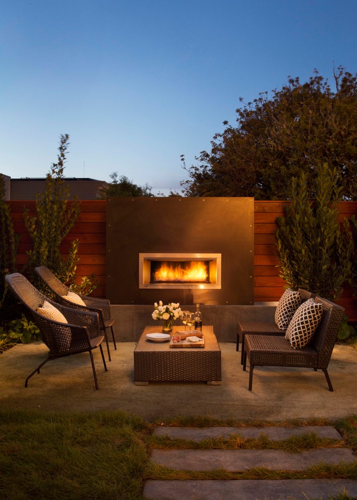 Contemporary backyard patio in San Francisco with no cover and with fireplace.