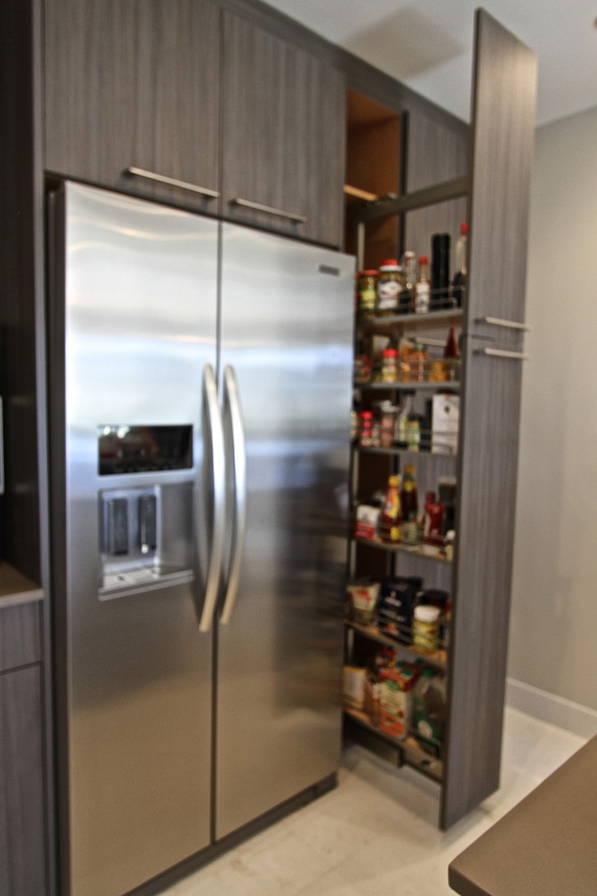 Inspiration for a mid-sized contemporary l-shaped ceramic tile eat-in kitchen remodel in Orange County with an undermount sink, flat-panel cabinets, dark wood cabinets, laminate countertops, blue backsplash, glass sheet backsplash, stainless steel appliances and an island