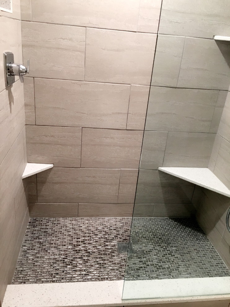 Example of a mid-sized transitional porcelain tile porcelain tile and beige floor alcove shower design in Detroit with a two-piece toilet and beige walls