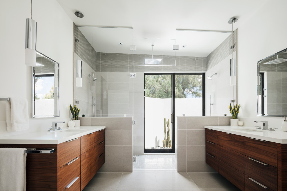 Design ideas for a midcentury master bathroom in Phoenix with flat-panel cabinets, dark wood cabinets, gray tile, porcelain tile, engineered quartz benchtops, white benchtops, a double vanity and a floating vanity.