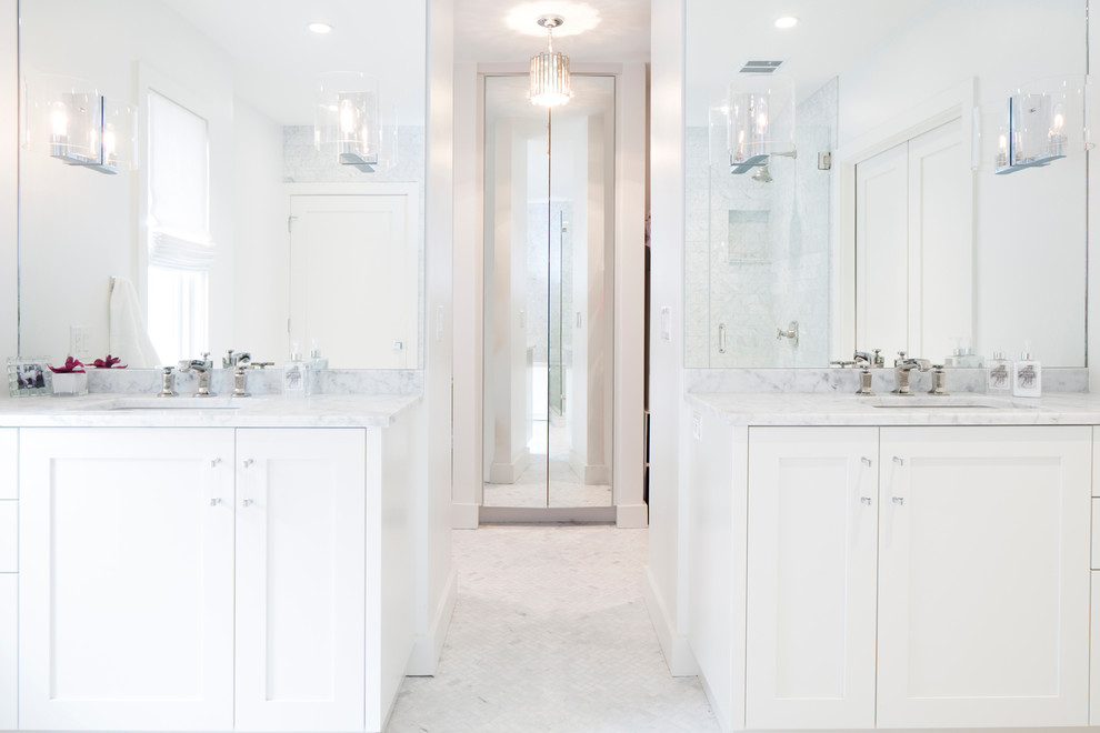 Design ideas for a large transitional master bathroom in Austin with shaker cabinets, white cabinets, a freestanding tub, marble benchtops, white walls, marble floors, an undermount sink and white floor.