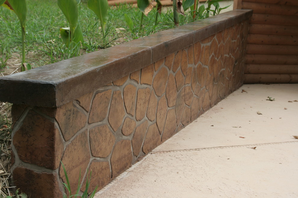This is an example of a large rustic partial sun hillside driveway.
