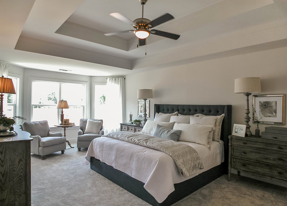 Mid-sized transitional master bedroom in Atlanta with white walls, carpet and beige floor.