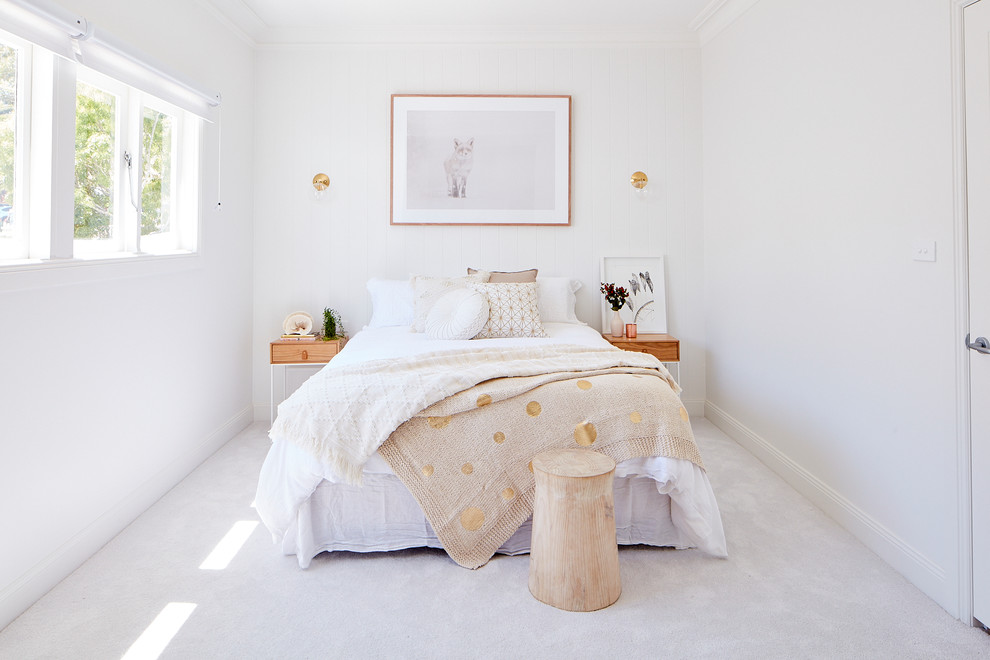 Photo of a mid-sized modern bedroom in Sydney with white walls, carpet, no fireplace and white floor.