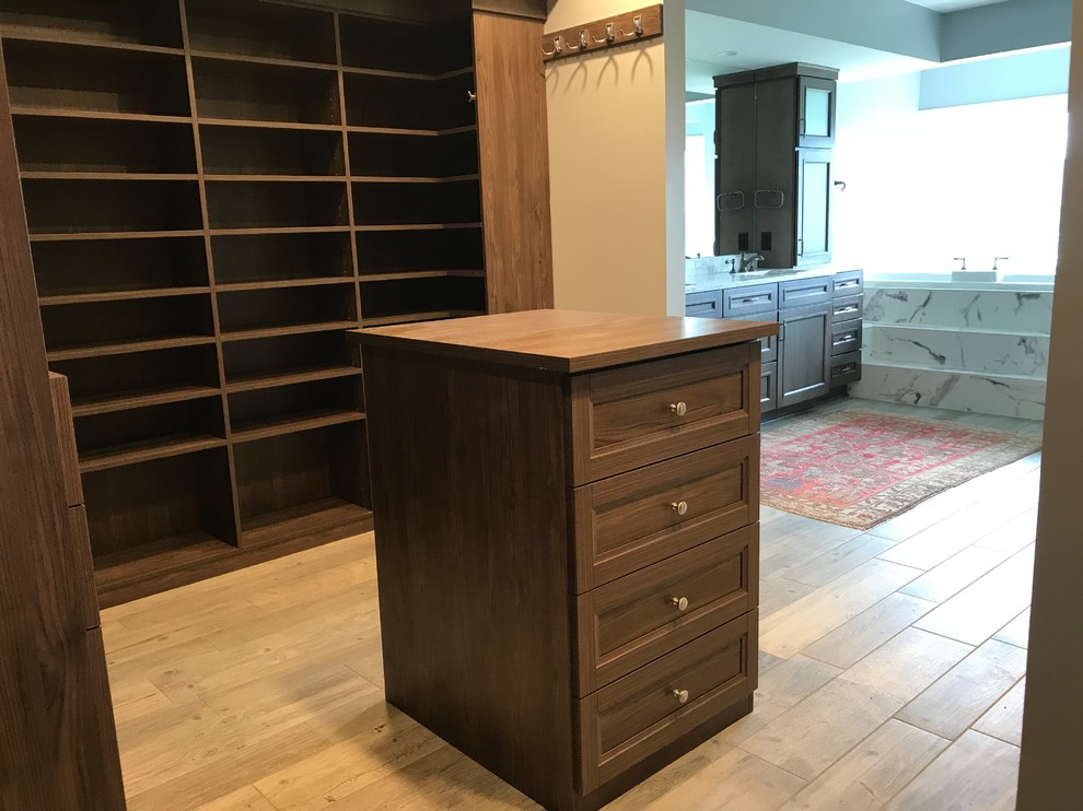 Inspiration for a large transitional master gray tile and marble tile porcelain tile and gray floor dressing room remodel in Cincinnati with recessed-panel cabinets, an undermount tub, a two-piece toilet, gray walls, an undermount sink, granite countertops, a hinged shower door and dark wood cabinets
