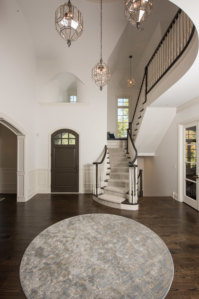 Inspiration for a large transitional dark wood floor and brown floor foyer remodel in Chicago with gray walls and a dark wood front door