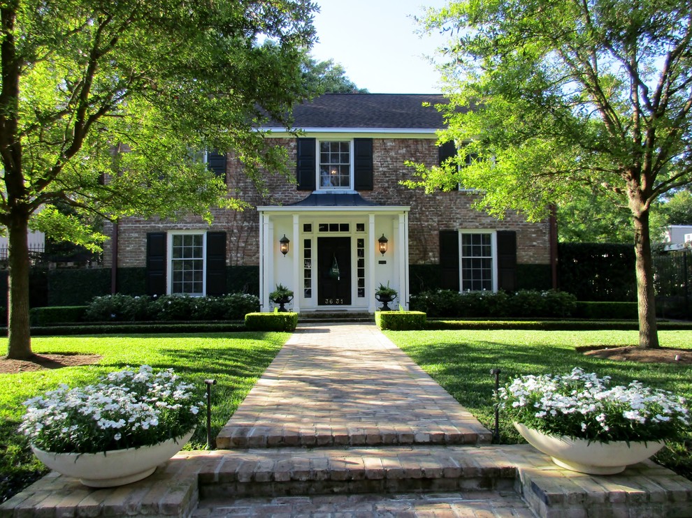 Photo of a traditional home design in Houston.