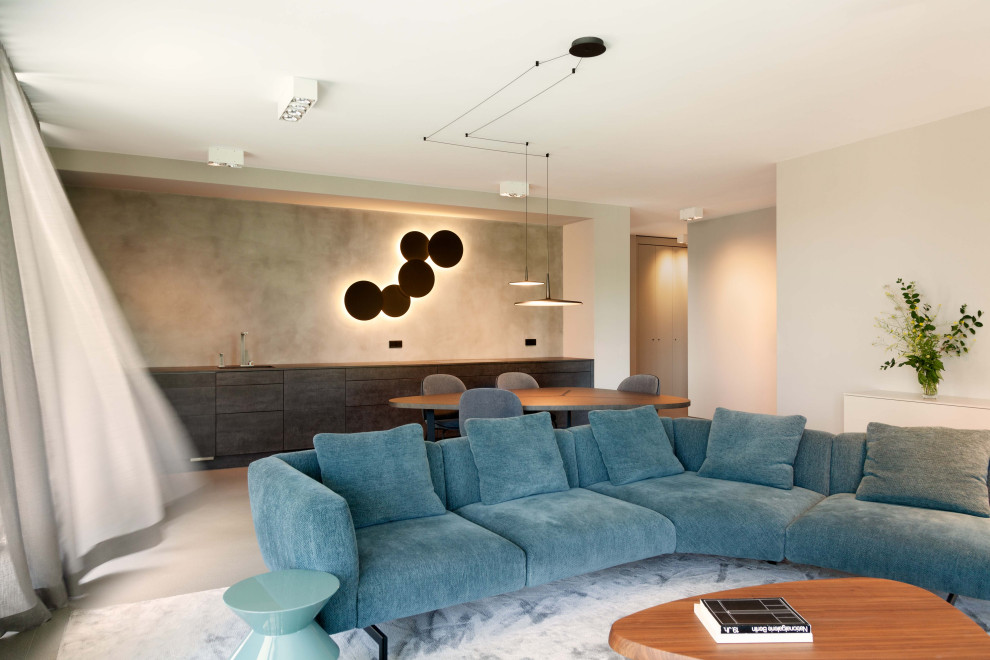 This is an example of an expansive contemporary formal open concept living room in Berlin with grey walls, concrete floors, no fireplace, no tv, grey floor, recessed and wallpaper.