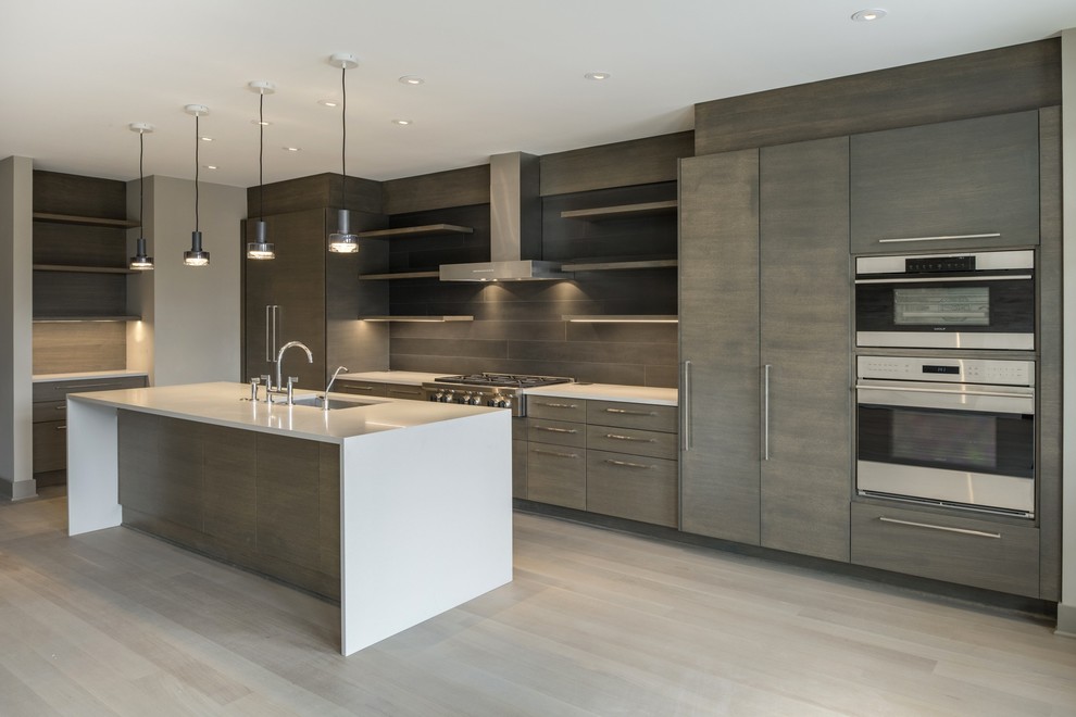 Inspiration for a mid-sized contemporary l-shaped open plan kitchen in Minneapolis with an undermount sink, flat-panel cabinets, light wood cabinets, quartz benchtops, grey splashback, timber splashback, stainless steel appliances, painted wood floors, with island and grey floor.