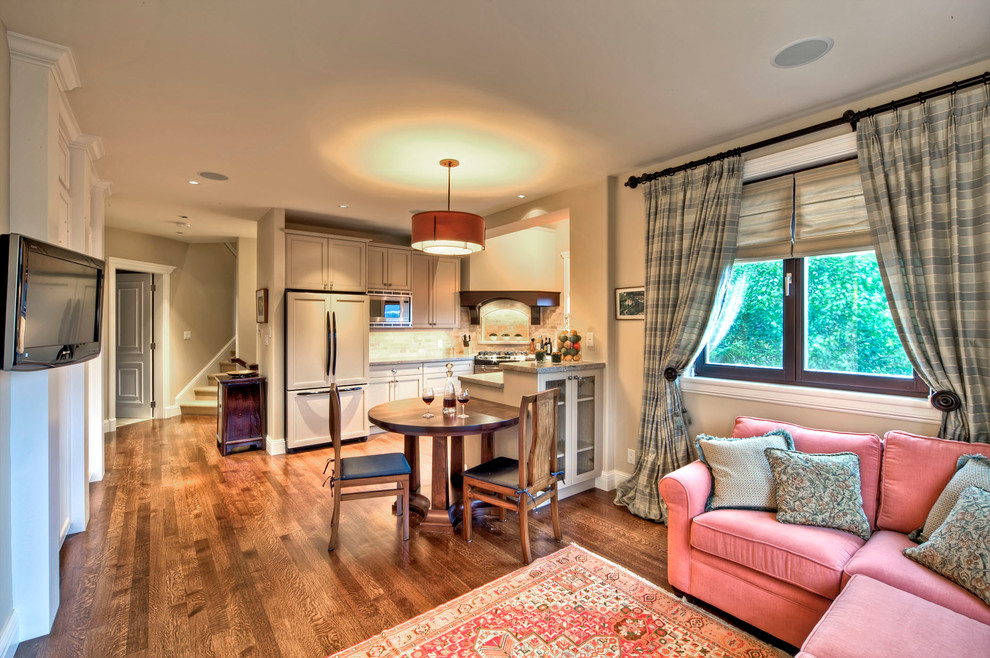 Inspiration for a large transitional l-shaped medium tone wood floor and brown floor eat-in kitchen remodel with a double-bowl sink, gray backsplash, recessed-panel cabinets, beige cabinets, subway tile backsplash, stainless steel appliances and a peninsula