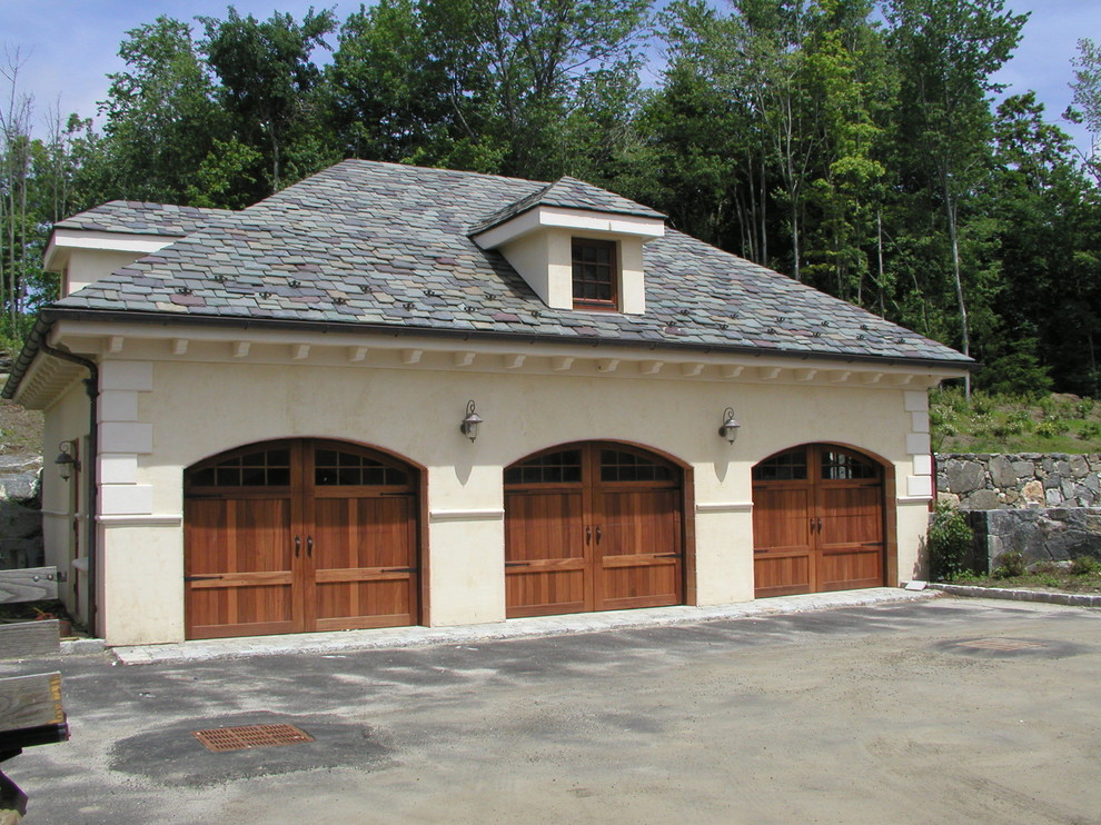 This is an example of an expansive mediterranean attached three-car carport in New York.