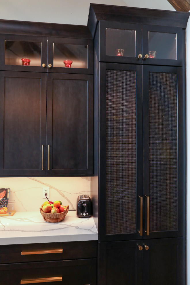 Inspiration for a large transitional u-shaped light wood floor open concept kitchen remodel with a farmhouse sink, flat-panel cabinets, dark wood cabinets, quartz countertops, white backsplash, quartz backsplash, stainless steel appliances, an island and white countertops