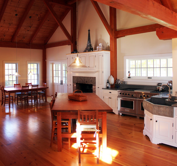 Open concept kitchen - large transitional l-shaped medium tone wood floor open concept kitchen idea in Boston with a farmhouse sink, raised-panel cabinets, white cabinets and no island