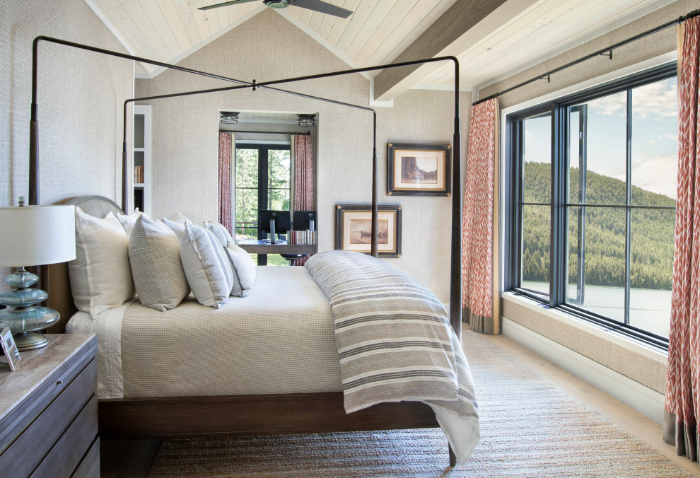 This is an example of a country master bedroom in Other with beige walls, light hardwood floors and beige floor.