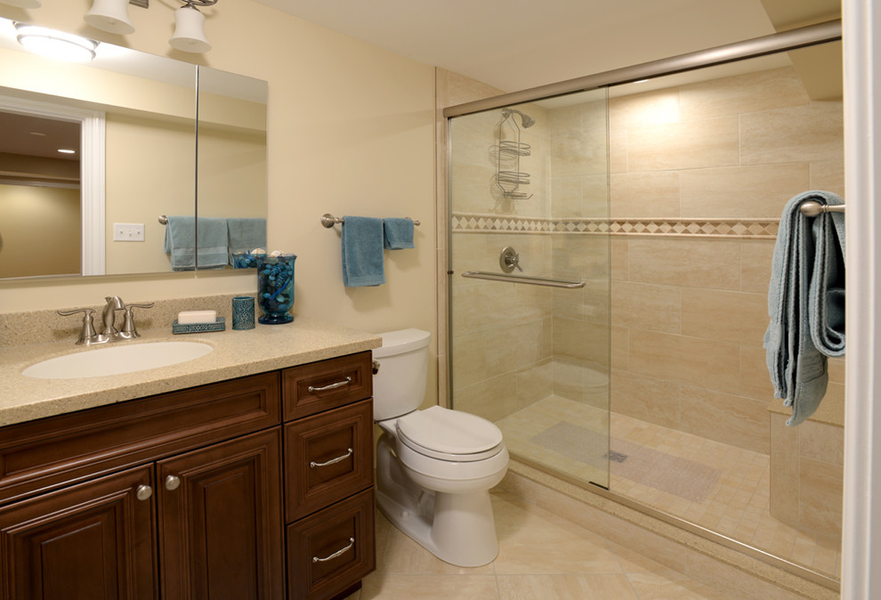 Design ideas for a small contemporary 3/4 bathroom in Chicago with raised-panel cabinets, medium wood cabinets, a double shower, a one-piece toilet, beige tile, ceramic tile, beige walls, porcelain floors, an undermount sink and engineered quartz benchtops.