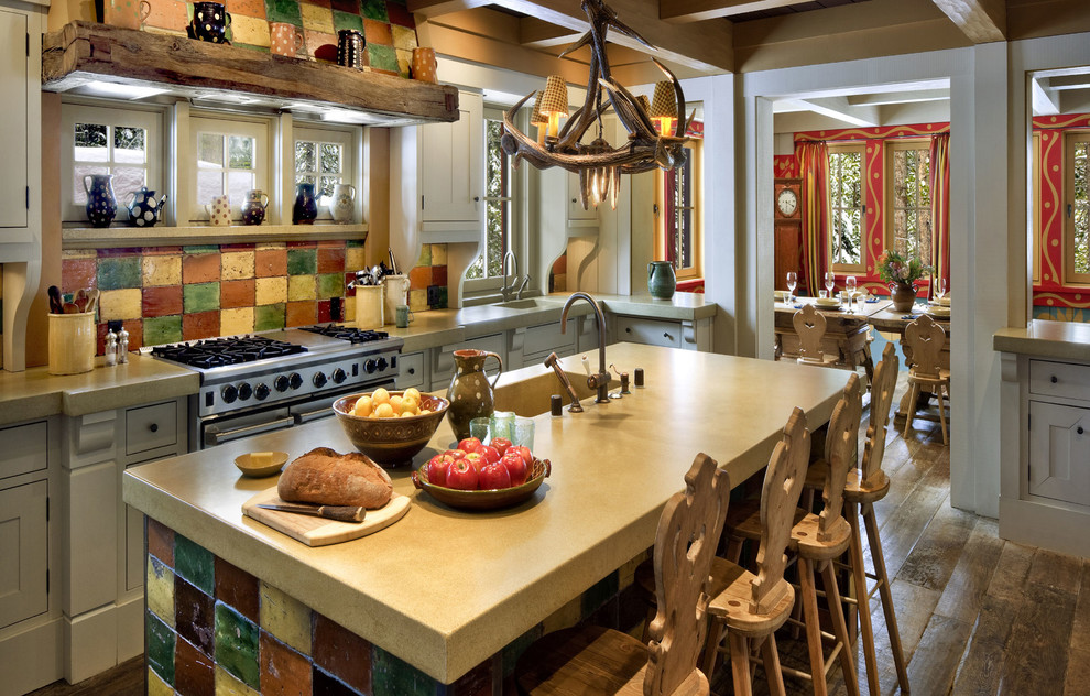 Photo of a large country single-wall eat-in kitchen in San Francisco with an integrated sink, stainless steel appliances, concrete benchtops, shaker cabinets, grey cabinets, multi-coloured splashback, ceramic splashback, dark hardwood floors, with island, brown floor and beige benchtop.