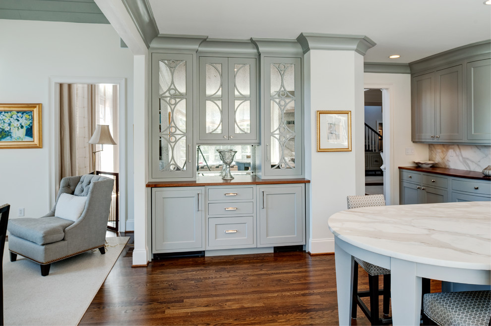 Transitional medium tone wood floor kitchen photo in Atlanta with recessed-panel cabinets, blue cabinets and an island
