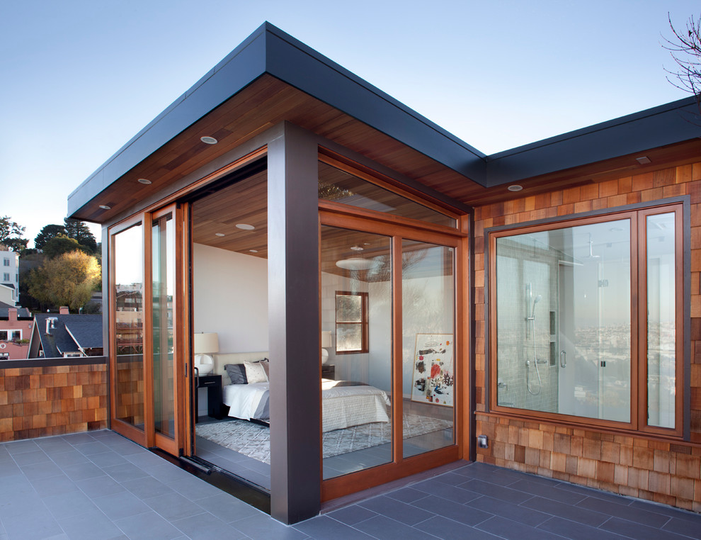Inspiration for a contemporary rooftop deck in San Francisco with a roof extension.