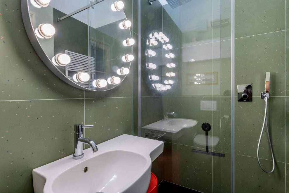 Small contemporary 3/4 bathroom in Milan with a curbless shower, a wall-mount toilet, green tile, porcelain tile, green walls, dark hardwood floors, a wall-mount sink, black floor, a sliding shower screen and a single vanity.