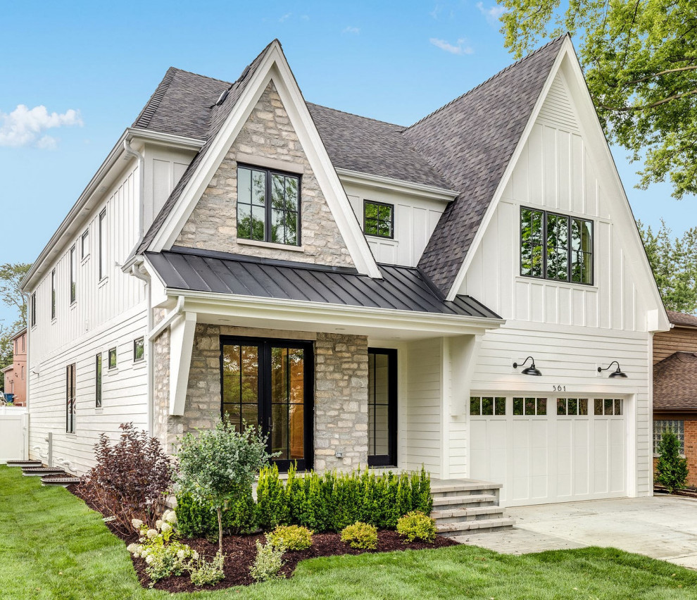 Transitional yellow two-story stone house exterior idea in Chicago with a shingle roof