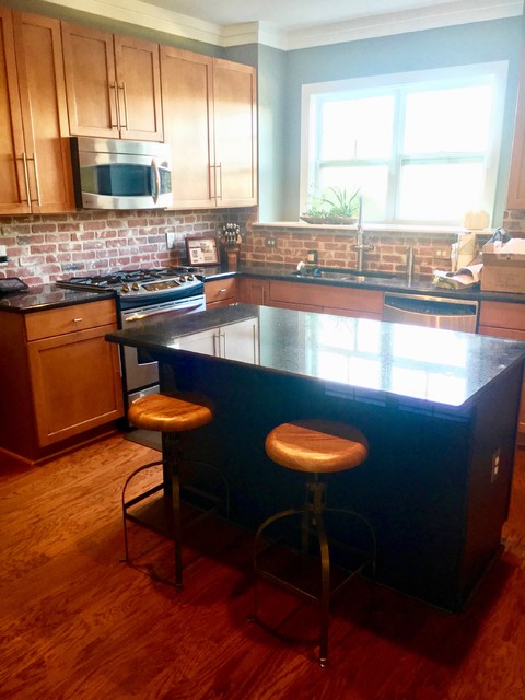 Mid-sized urban l-shaped medium tone wood floor and brown floor eat-in kitchen photo in Charlotte with an undermount sink, shaker cabinets, medium tone wood cabinets, red backsplash, brick backsplash, stainless steel appliances and an island
