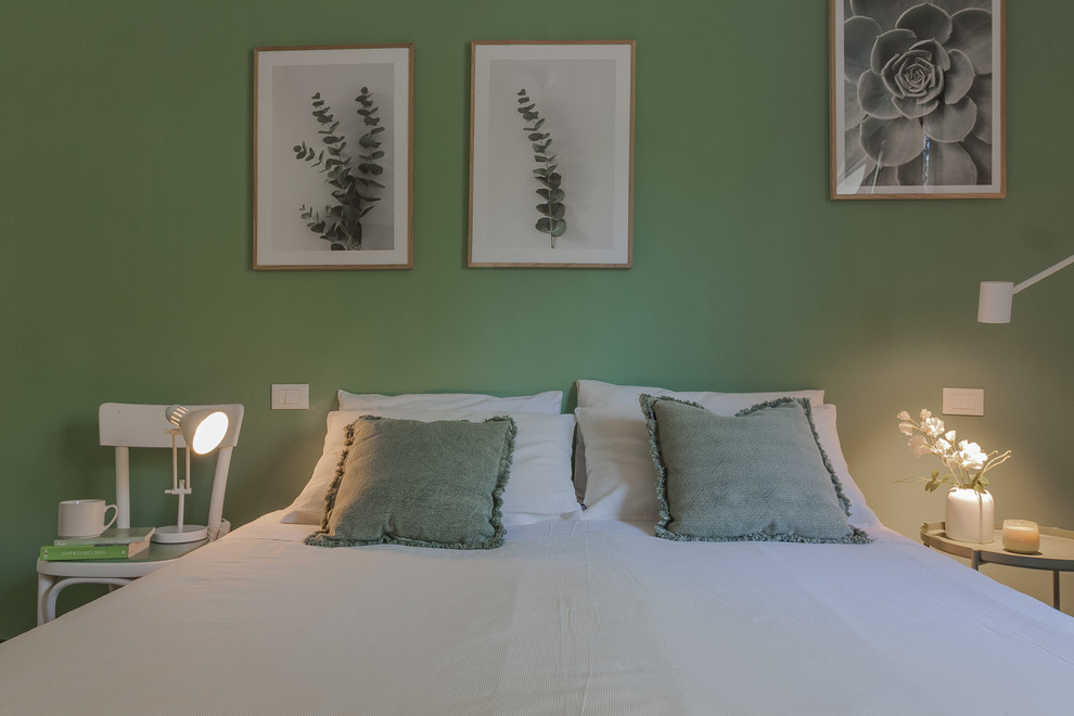 Expansive scandinavian master bedroom in Other with green walls, dark hardwood floors and brown floor.