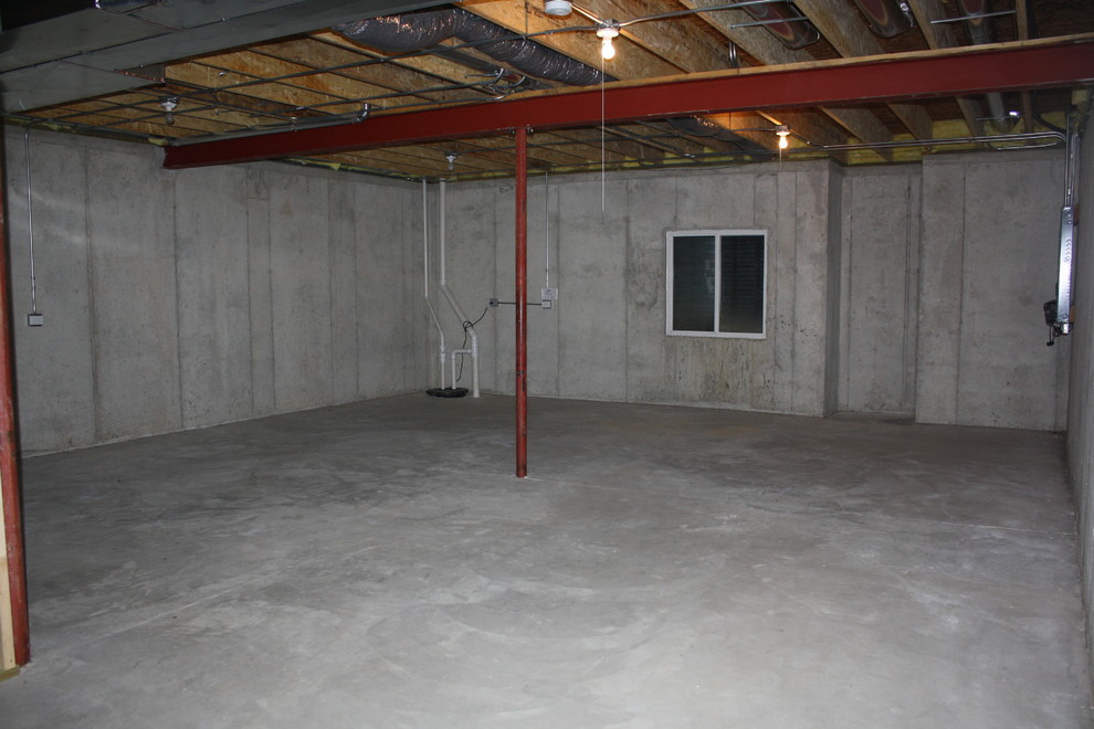 Mid-sized minimalist underground concrete floor basement photo