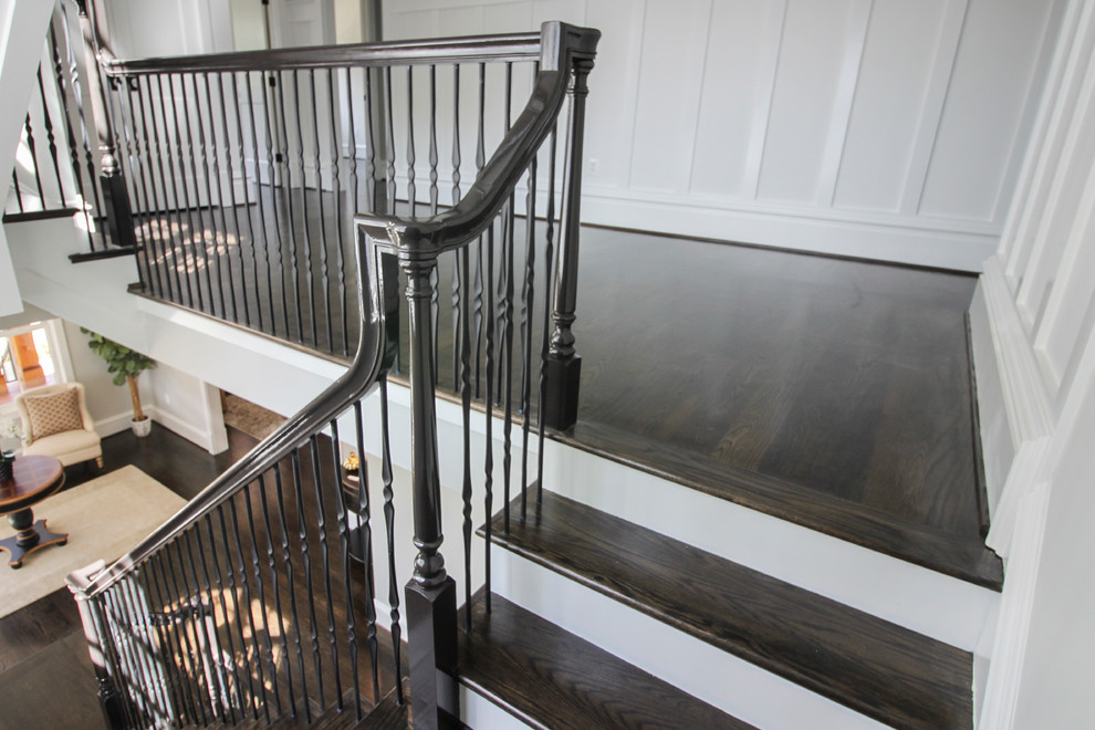 Example of a large transitional wooden l-shaped mixed material railing staircase design in DC Metro with painted risers