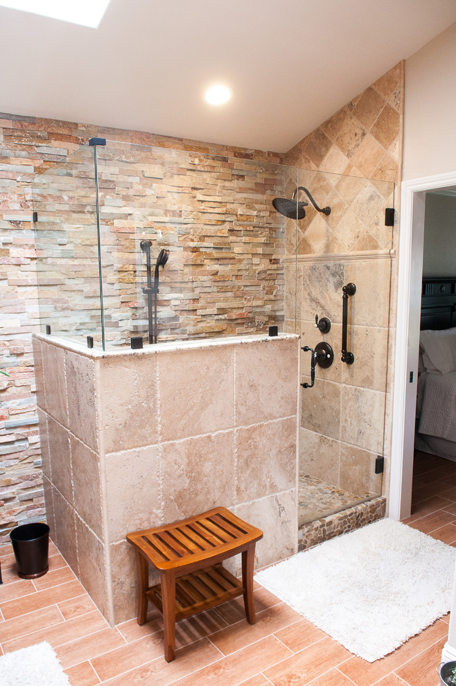 Inspiration for a mid-sized rustic master beige tile and stone tile porcelain tile and beige floor corner shower remodel with beige walls and a hinged shower door