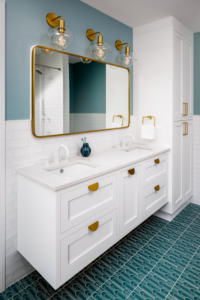 This is an example of a transitional master bathroom in DC Metro with shaker cabinets, white cabinets, an alcove shower, white tile, subway tile, blue walls, ceramic floors, an undermount sink, engineered quartz benchtops, blue floor, a shower curtain, beige benchtops, a double vanity and a floating vanity.