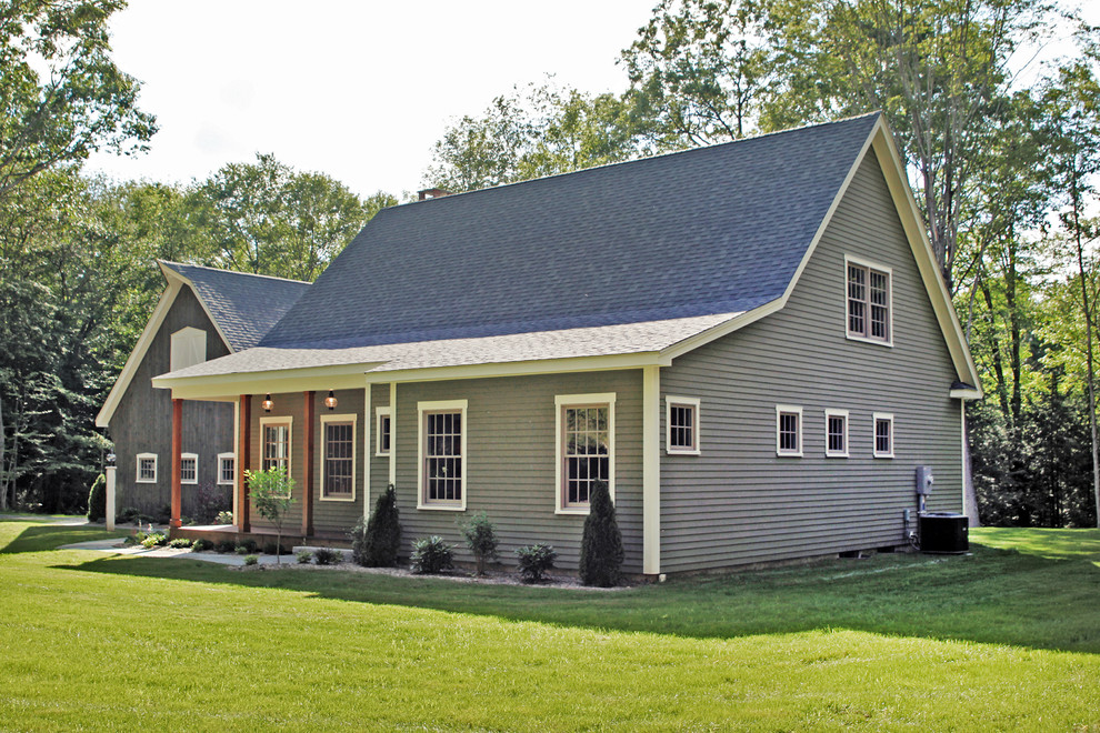 Design ideas for a country two-storey exterior in New York with vinyl siding.