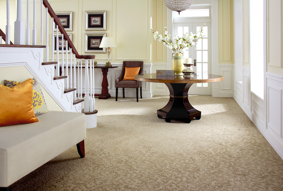 Inspiration for a mid-sized transitional carpeted and brown floor foyer remodel with yellow walls and a white front door