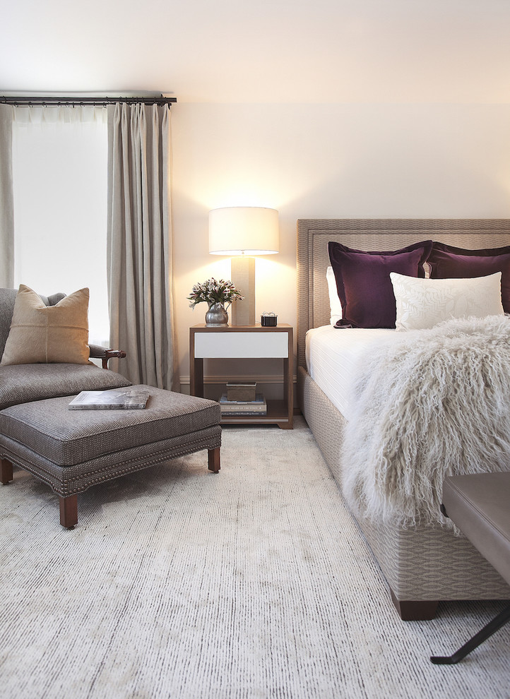 Design ideas for a transitional master bedroom in New York with carpet.
