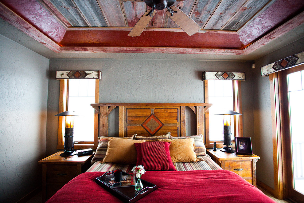 Mid-sized mountain style bedroom photo with gray walls