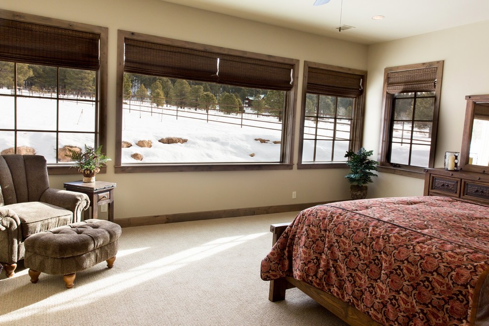 Large mountain style carpeted and beige floor bedroom photo in Phoenix with beige walls and no fireplace