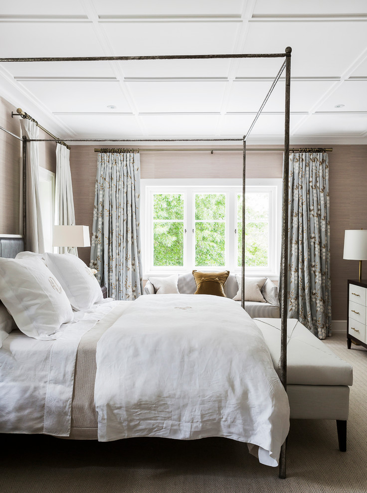 This is an example of a traditional master bedroom in Sydney with grey walls and carpet.