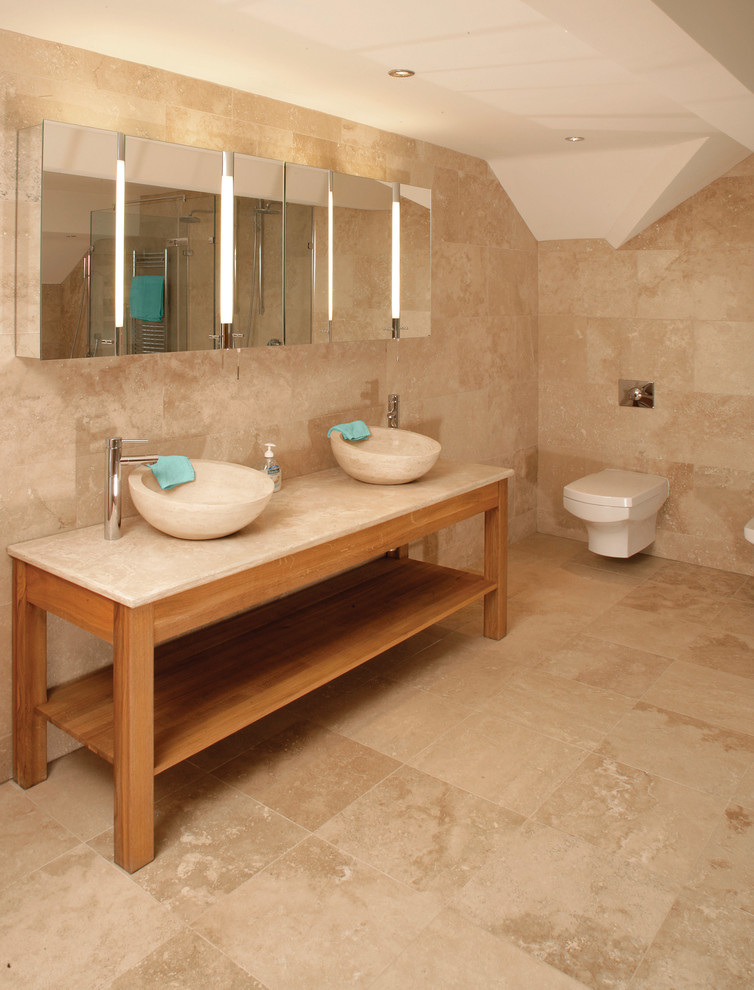 This is an example of a mid-sized modern master bathroom in Other with an alcove shower, beige tile, stone tile, travertine floors and a wall-mount toilet.