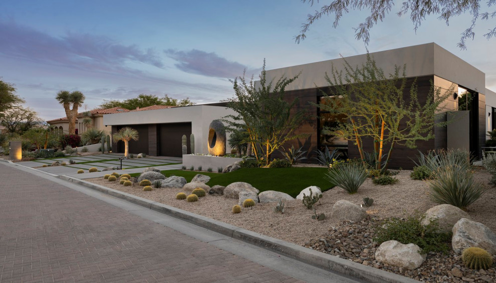 Photo of a large modern front xeriscape full sun garden in Los Angeles with a desert look and gravel.