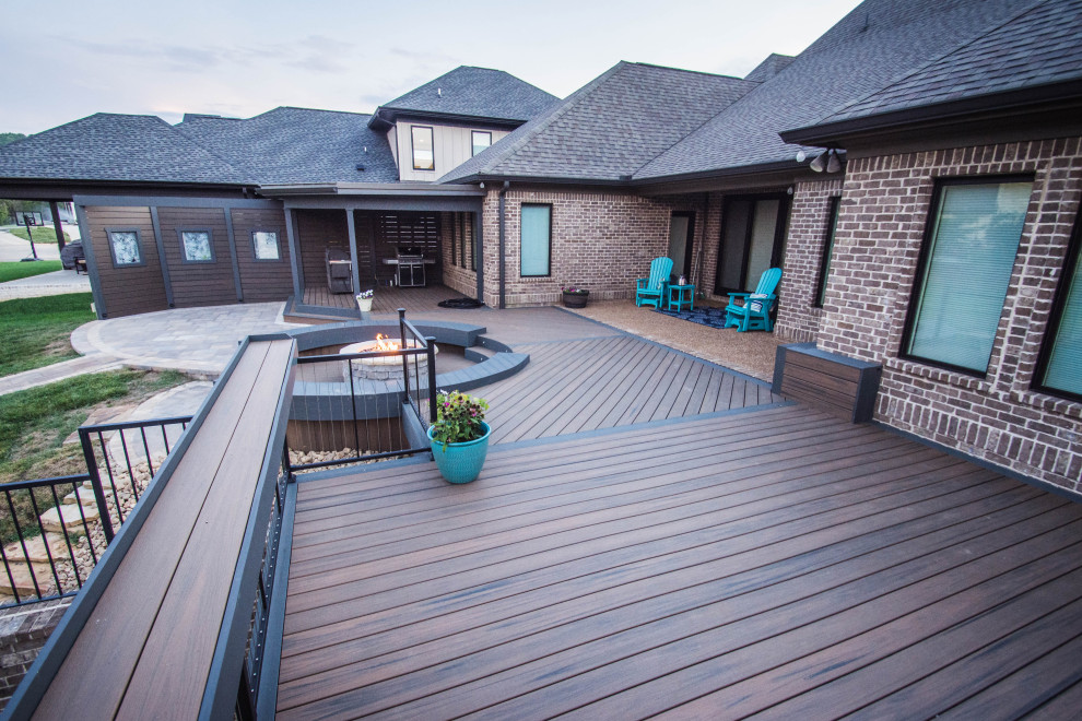 Large transitional backyard deck photo with a fire pit and no cover
