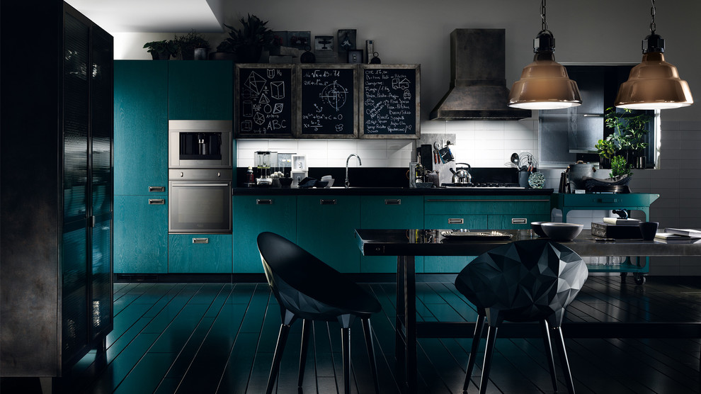 Inspiration for a large industrial l-shaped eat-in kitchen in Melbourne with a double-bowl sink, raised-panel cabinets, blue cabinets, quartzite benchtops, black splashback, ceramic splashback, stainless steel appliances, dark hardwood floors and multiple islands.