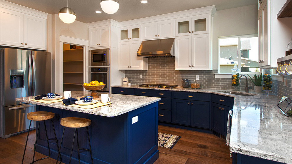 Transitional dark wood floor eat-in kitchen photo in Salt Lake City with a drop-in sink, flat-panel cabinets, blue cabinets, quartz countertops, stainless steel appliances and an island