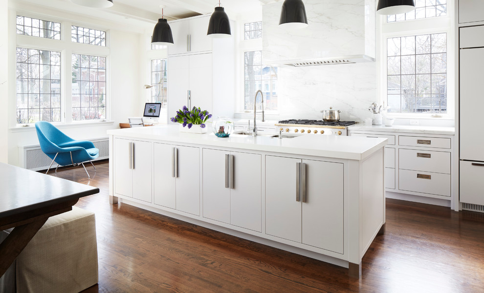 Inspiration for a mid-sized transitional galley medium tone wood floor open concept kitchen remodel in Chicago with a double-bowl sink, beaded inset cabinets, white cabinets, quartz countertops, white backsplash, marble backsplash, paneled appliances and an island