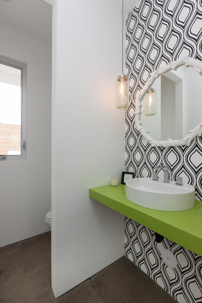 Design ideas for a contemporary powder room in Orange County with a vessel sink, white walls, concrete floors, brown floor and green benchtops.
