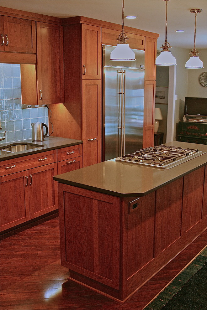 Inspiration for a transitional laminate floor kitchen remodel in DC Metro with shaker cabinets, quartz countertops, blue backsplash and porcelain backsplash
