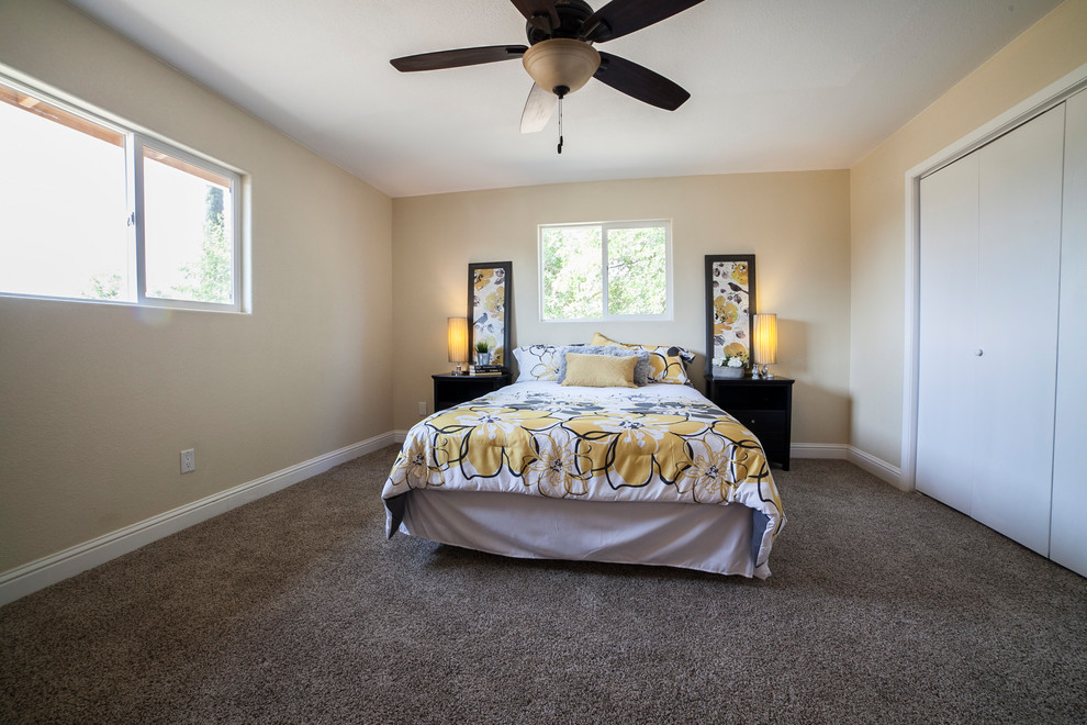 Design ideas for a mid-sized transitional bedroom in Sacramento with beige walls, carpet, no fireplace and brown floor.