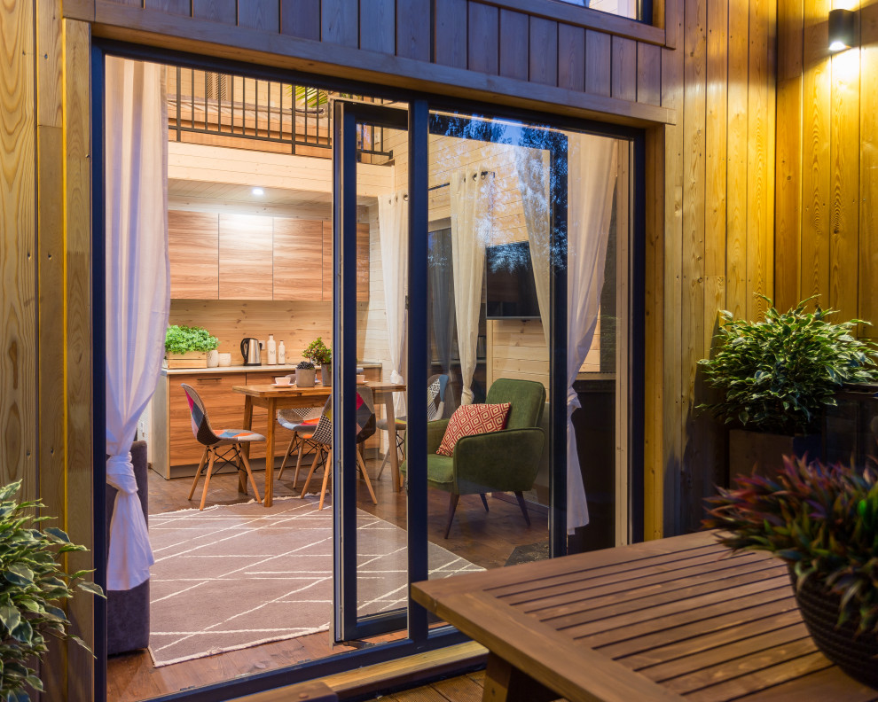 Photo of a small scandinavian backyard deck in Other.