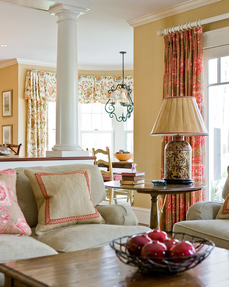 Inspiration for a mid-sized traditional open concept family room in Boston with beige walls and light hardwood floors.