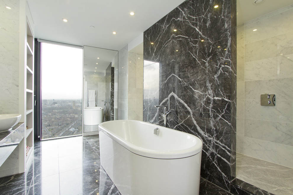 This is an example of a contemporary bathroom in London with marble.