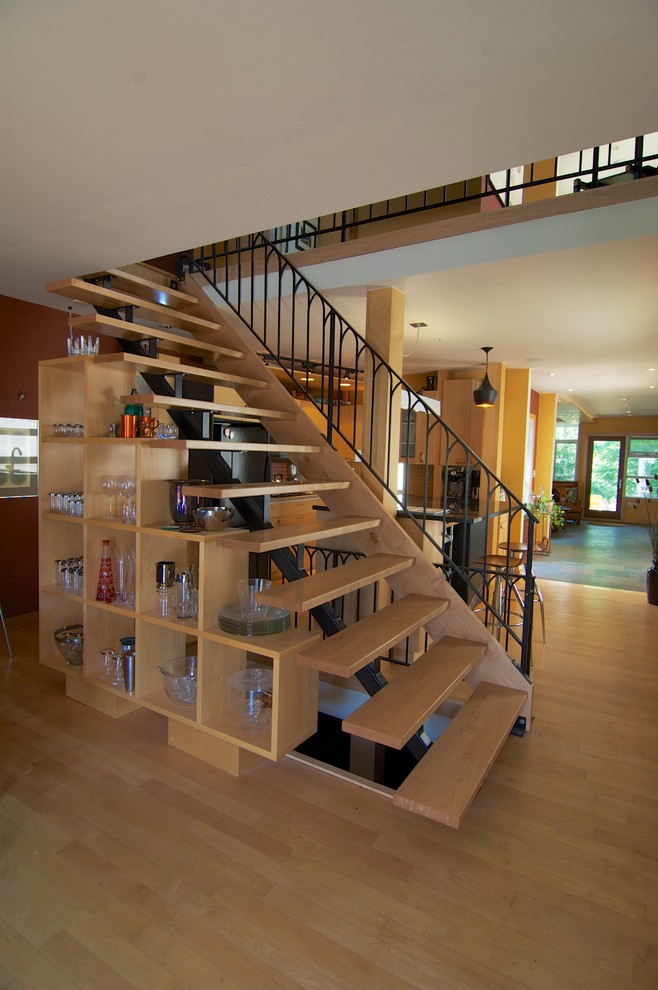 This is an example of a mid-sized contemporary wood straight staircase in Toronto with open risers.